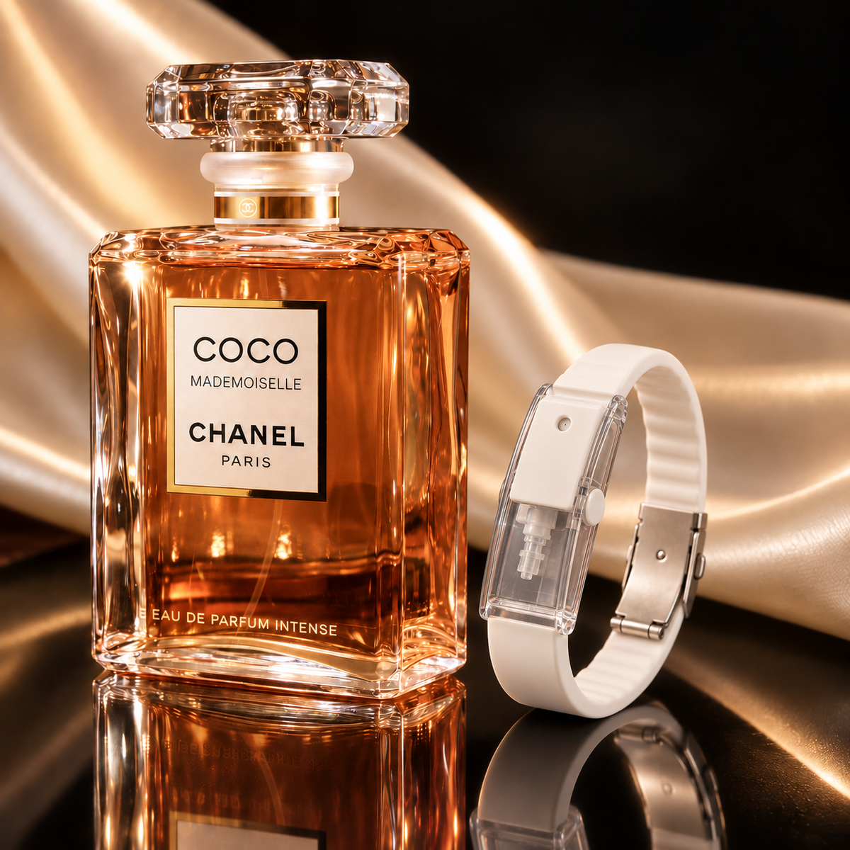 The Pearl White RIVYRE bracelet on gold silk beside a gold-toned glass fragrance bottle
